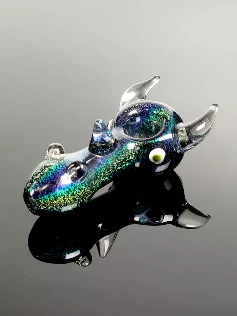 Blue and green lumenus design spoon with horns and eyes