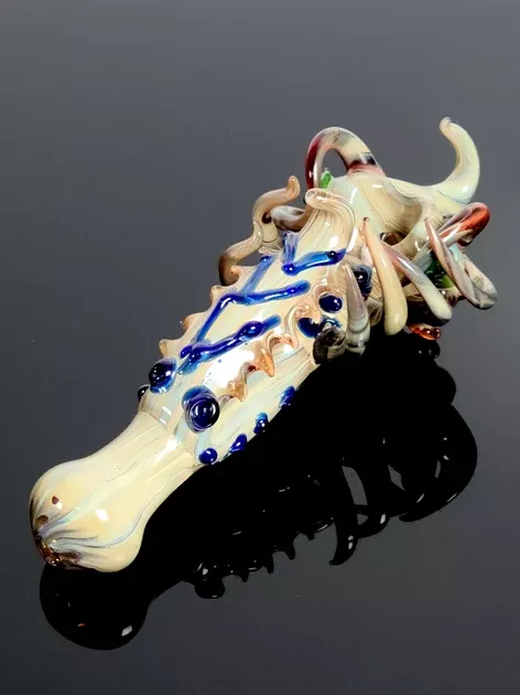 Creature pipe with swirls and tentacles